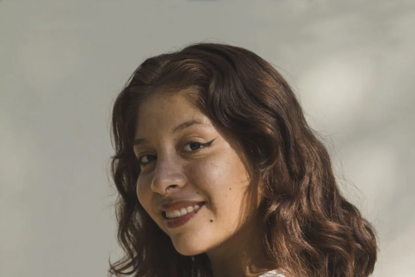 Woman showing a natural smile in soft daylight